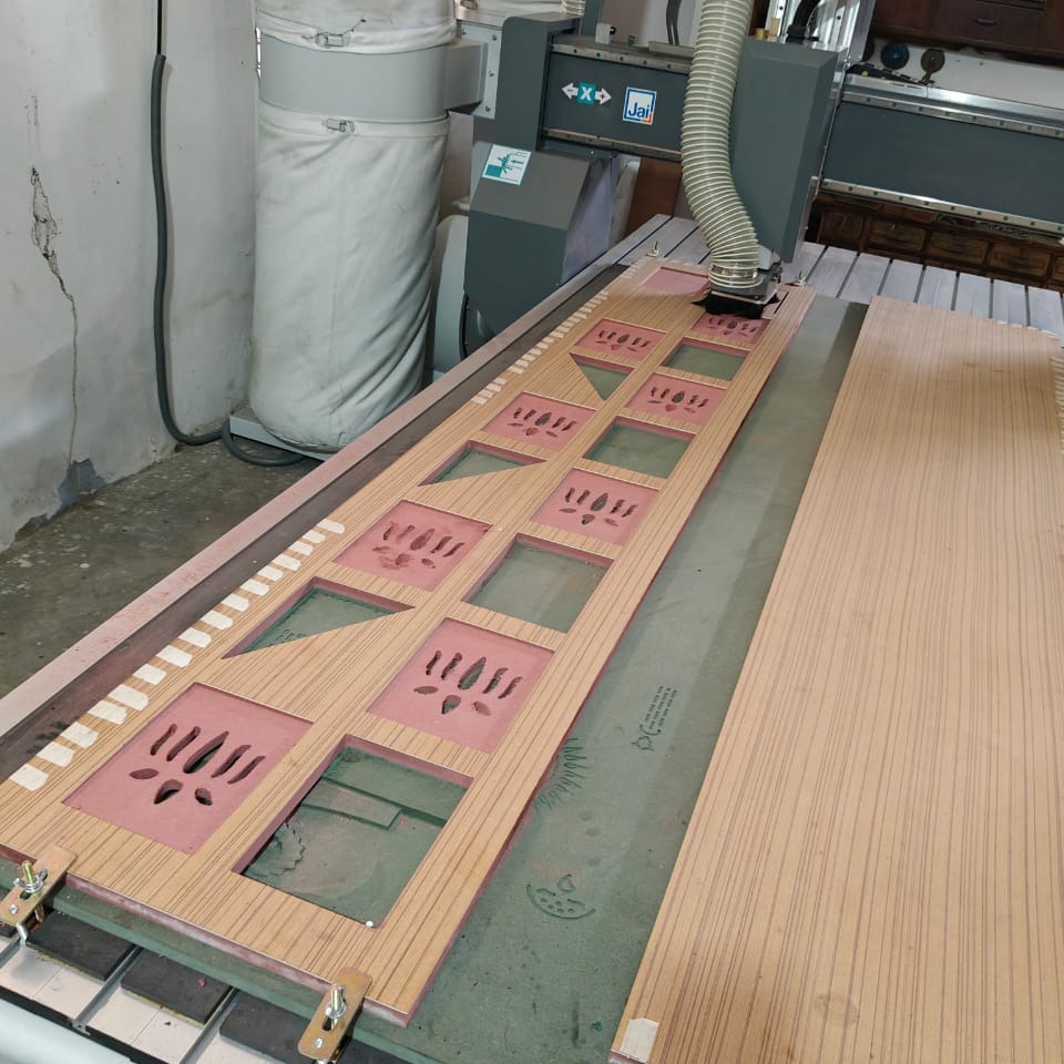 CNC router cutting a wooden door panel in Vishwakarma workshop