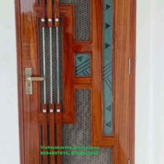 Brown wooden mesh-jali main door with green frosted-glass diamond inserts