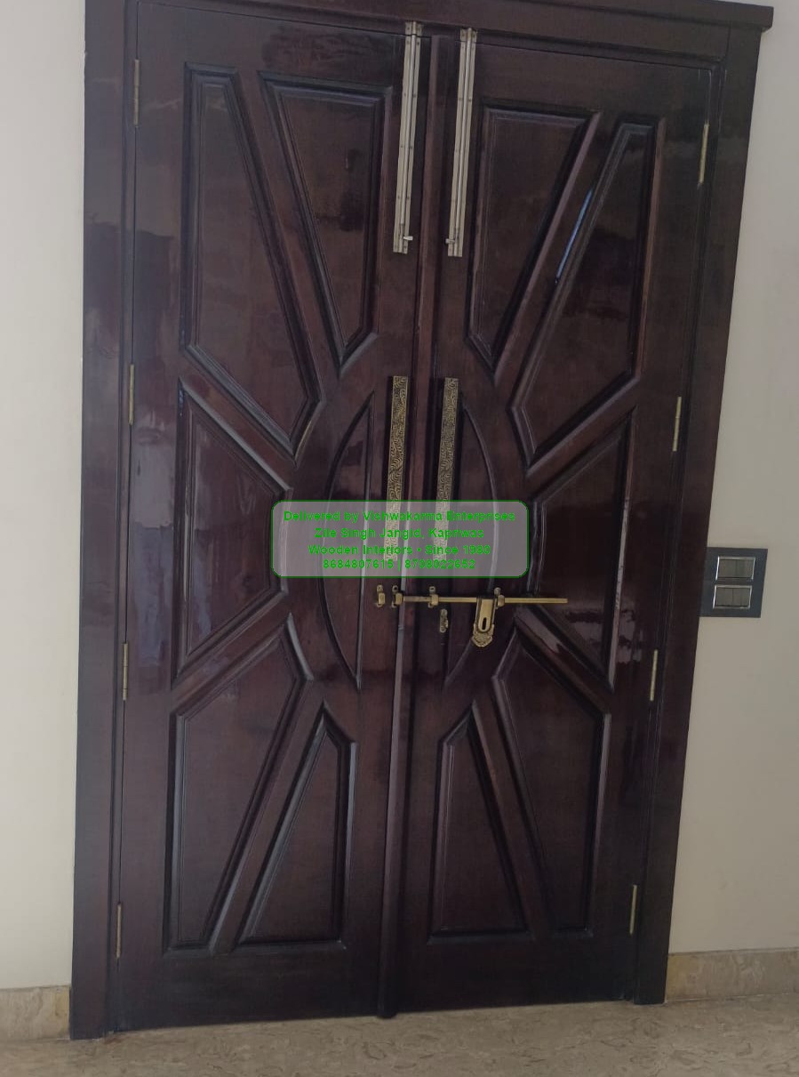 Dark mahogany carved double main door with brass handles