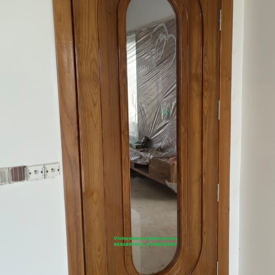 Wooden internal door with full-height oval glass insert in teak finish