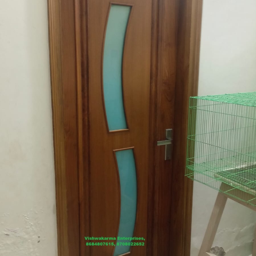 Teak internal door with curved frosted-glass S-shape inserts