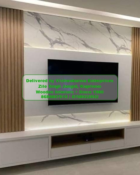 Modern TV unit with marble back panel, fluted wood sides and illuminated cove — Vishwakarma Enterprises