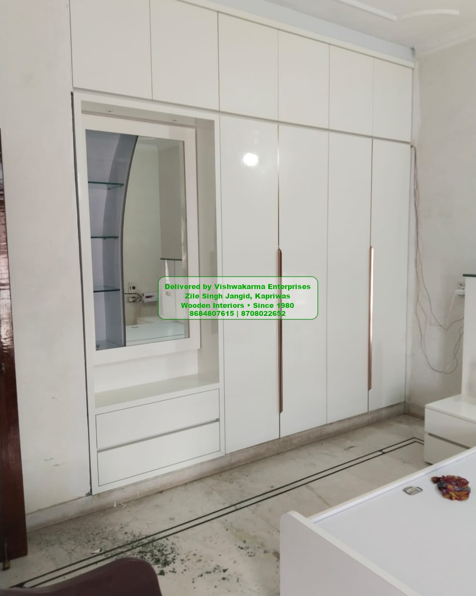 Tall white wardrobe with arched glass dressing-mirror niche — Vishwakarma Enterprises bespoke storage