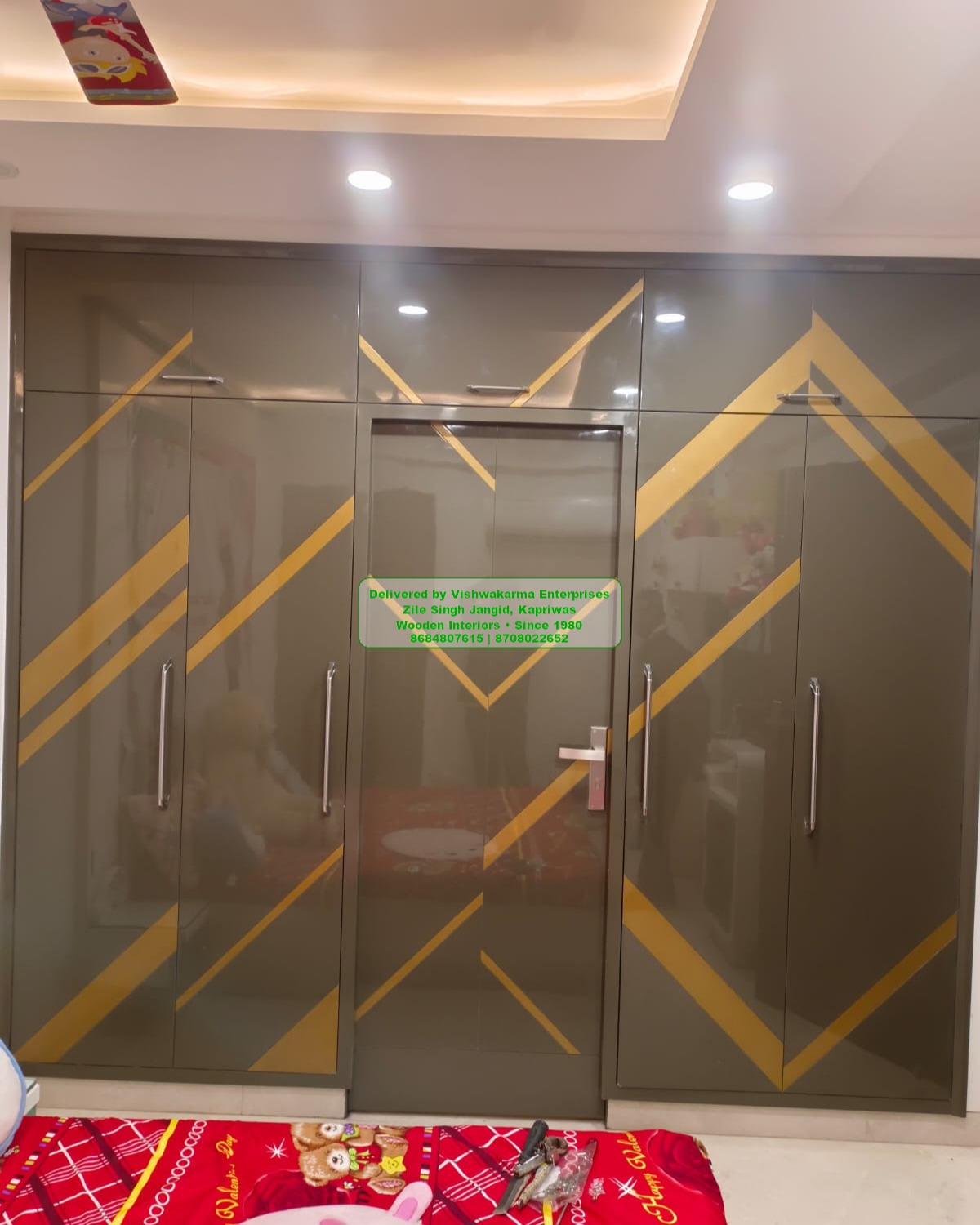 Glossy grey 6-door wardrobe with gold V-stripe inlay