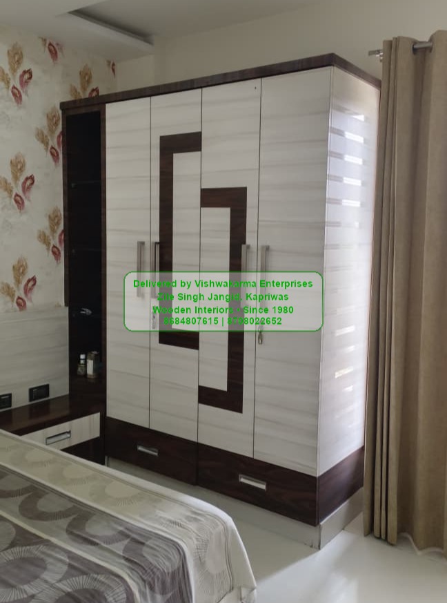 4-door wardrobe with white marble-laminate doors and walnut G-pattern inlay — Vishwakarma Enterprises bedroom install